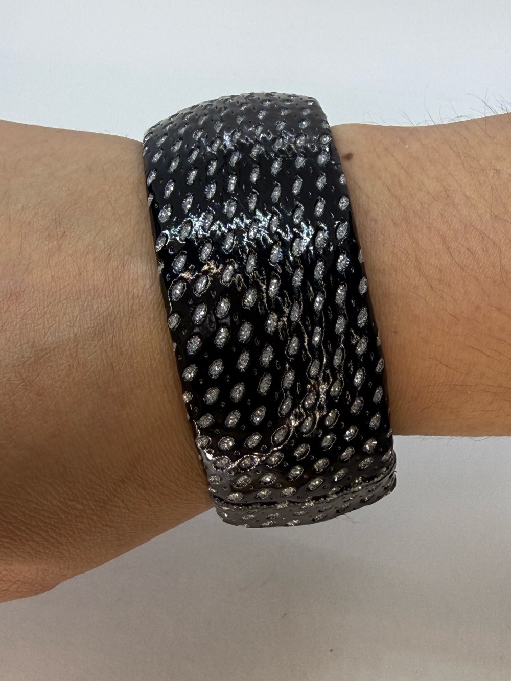 Textured faux leather bracelet in silver and black tones